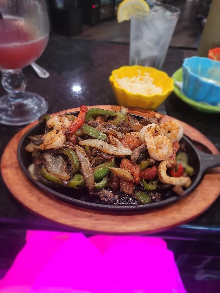 Shrimp Chicken and Steak Fajitas